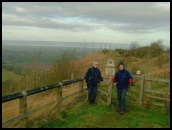 Mick and Peter outside the National Trust owned land at Coaley Peak with the River Severn beyond .